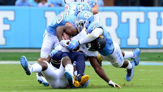 Cayson Collins (23) and Cole Holcomb (36)