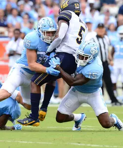 Cole Holcomb (36) and Donnie Miles (15)Cole Holcomb (36) and Donnie Miles (15)
