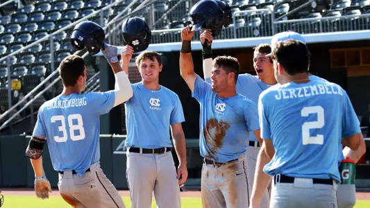 Kip Brandenburg (38) comes home after his grand slam home run.