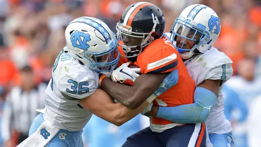 Cole Holcomb (36) and Myles Dorn (1)