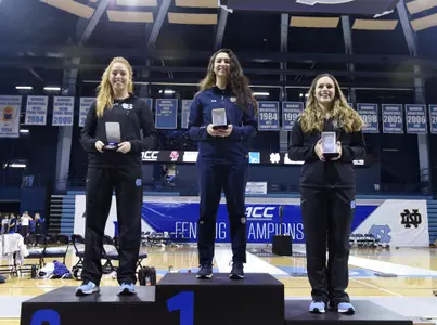 Notre Dame's Amanda Sirico, center, North Carolina's Georgina Summers, left, and North Carolina's Justine de Grasse are the first, second and third place finishers in the women's ÈpÈe at the 2018 ACC Fencing Championships in Chapel Hill, N.C., Saturday, February 24, 2018. (Photo by Liz Condo, theACC.com)