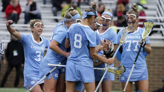 North Carolina players surround Gianna Bowe after she scored during the first half of the 2019 ACC Lacrosse Championship against Boston in Chestnut Hill, Ma., Sunday, April 28, 2019. (Photo by Mary Schwalm, the ACC)