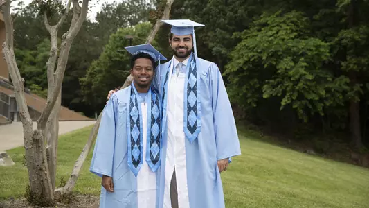 Corey Bell Jr. and Luke Maye, graduation 2019