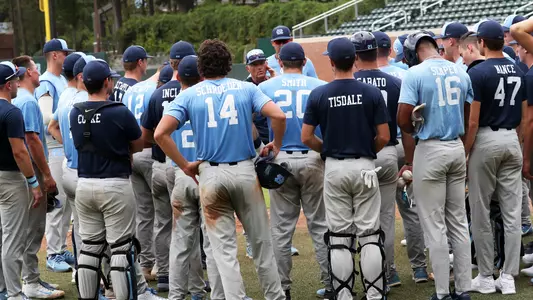 Coach Fox (30) talks to the team.