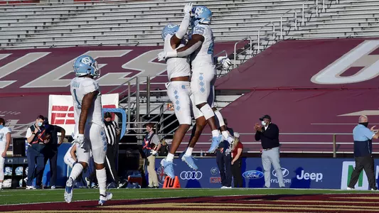 Javonte Williams, Khafre Brown, and Dyami Brown