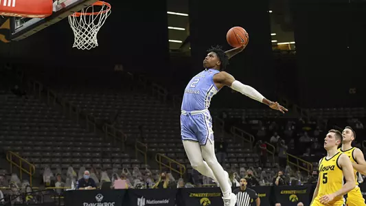 North Carolina Tar Heels guard Caleb Love (2) dunks the ball during the second half of their B1G/ACC Challenge  game at Carver-Hawkeye Arena in Iowa City, Iowa on Tuesday, December 8, 2020. (Stephen Mally/hawkeyesports.com)