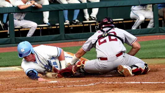 Colin Moran slides safely into home.