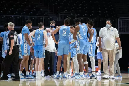 huddle at Miami