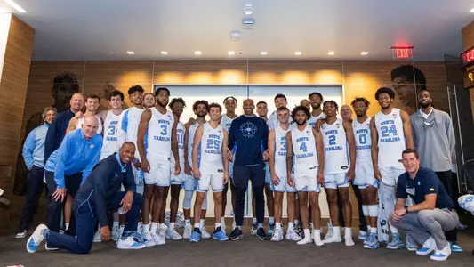 Vince Carter with team in locker room vs. Elilzabeth City State