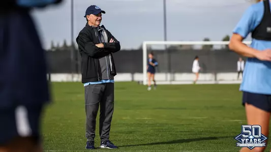 Anson Dorrance 50 years of women's athletics logo