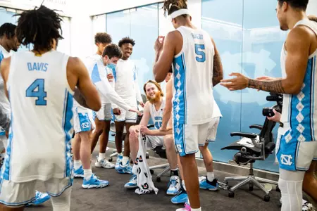 Manek in locker room