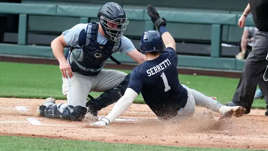 Eric Grintz (5) takes a strong Angel Zarate (40) throw and tags out Danny Serretti (1) in the first.