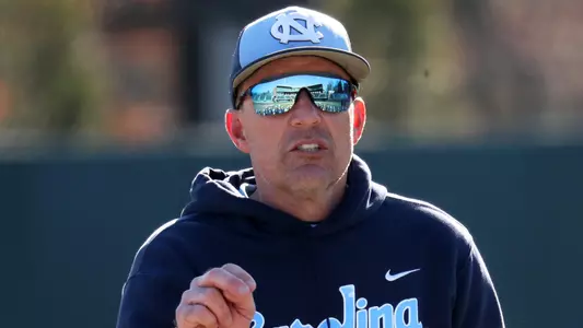 Coach Forbes (21) talks to the team after the scrimmage.