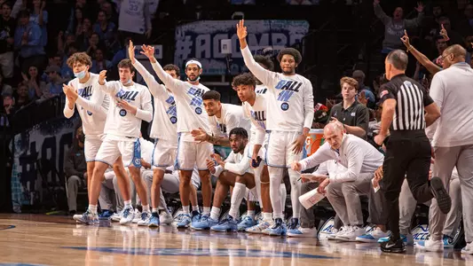 bench celebrates ACC Tournament vs. Virginia