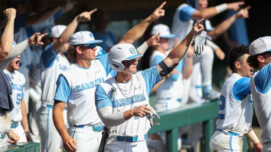 Mac Horvath and the UNC dugout.