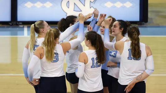 The Tar Heels huddle on the court.