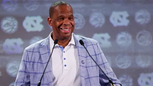 North Carolina head coach Hubert Davis answers a question at the 2023 ACC Kickoff in Charlotte, N.C., Wednesday, Oct. 25, 2023. (Photo by Nell Redmond/ACC)