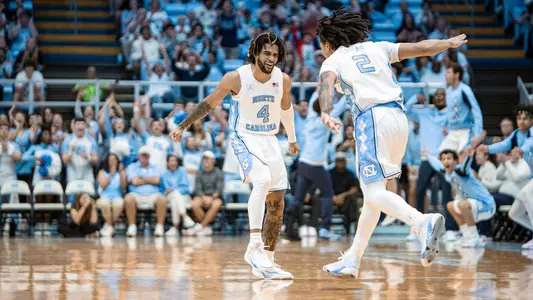 Elliot Cadeau, RJ Davis celebrate vs. St. Augustine's
