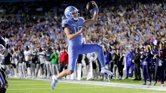 Sophomore Drake Maye drives into the end zone for a touchdown against Duke Saturday night at Kenan Stadium.