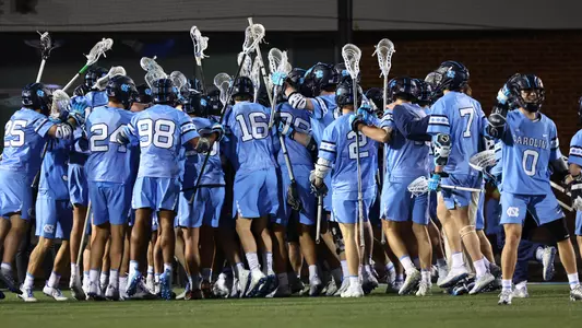 UNC celebrates defeating Johns Hopkins.