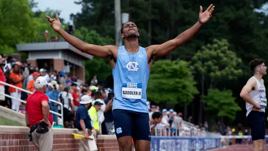 Junior Craig Saddler II reacts to his victory in the 400-meter hurdles at the ACC Championships. Saddler set a personal best of 49.84 seconds in the finals.