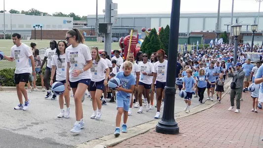 Tar Heel student athletes along with Tar Heel fans participate in the Dribble For Victory Over Cancer event held on campus Sunday morning. The event raised $65,000 for pediatric cancer research.