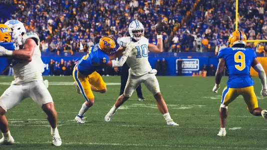 Sophomore quarterback Drake Maye looks to throw to the endzone with his off hand against Pittsburgh. Maye made to the completion to wide receiver Kobe Paysour for the score.