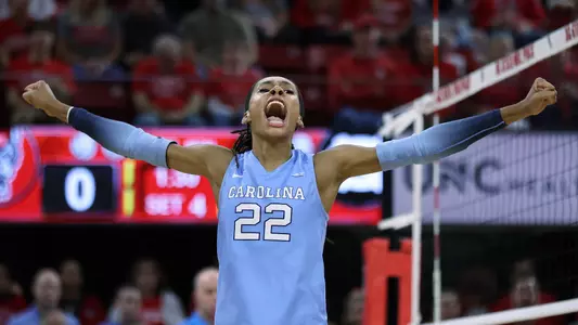 Sophomore Safi Hampton reacts to a kill against North Carolina State University at Reynolds Coliseum in Raleigh on Friday night.