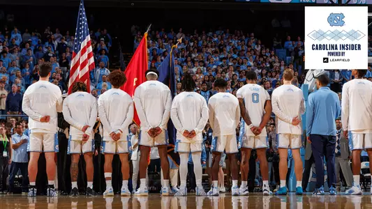 Carolina Insider 11/12/24, MBB team with flag at anthem