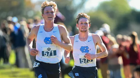 Seniors Ethan Strand, left, and Parker Wolfe finished fifth and sixth at the NCAA Southeast Regional meet at the Winthrop Farm Cross Country Course Friday. The team finished in second place to earn a spot at the NCAA Championships.