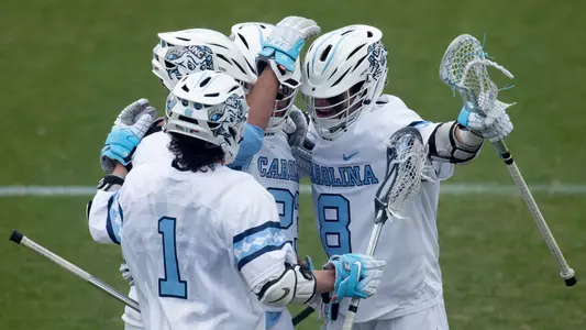 The Tar Heels celebrate scoring a goal against Johns Hopkins.