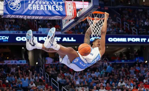 Graduate student Armando Bacot dunks against Pitt on Friday at Capital One Arena in Washington, D.C., on Friday.