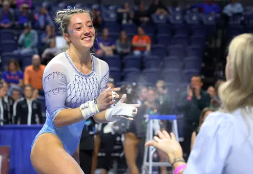 Junior Isabelle Schaefer reacts to her uneven bar routine during NCAA Regional Championship on Friday at Exatech Arena at the Stephen C. O'Connell Center in Gainesville, Fla.