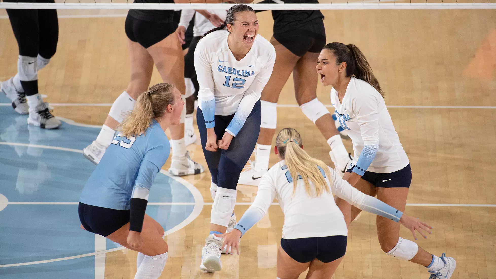 Alexis Engelbrecht and the Tar Heels celebrate a point.