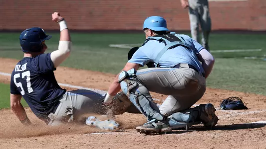 Macaddin Dye (12) tags out Mitch Wilson (57) at home.