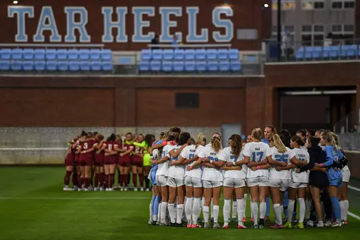 The Tar Heels huddle on Dorrance Field prior to taking on Boston College Thursday evening.