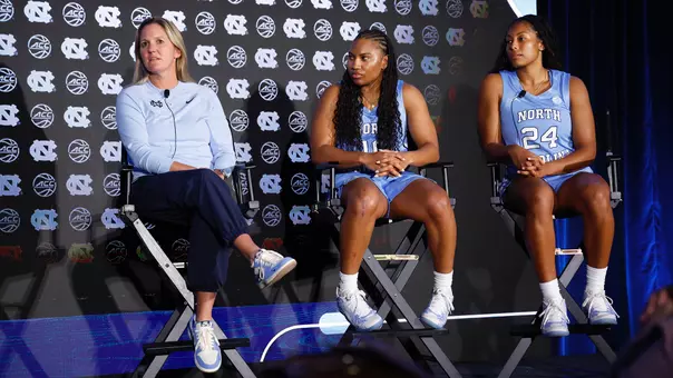 North Carolina head coach Courtney Banghart with guards Reniya Kelly and Indya Nivar at the 2025 ACC Women’s Basketball Tipoff in Charlotte, N.C., Monday, Oct. 6, 2025. (Nell Redmond/ACC Photo)