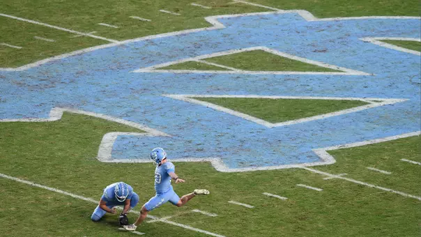Senior Rece Verhoff (90) takes a field goal attempt against Duke at Kenan Stadium Saturday.
