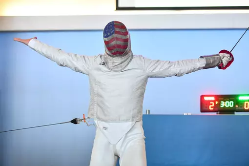 Freshman Vasil Atanassov celebrates a point against Duke in sabre at the Blue Zone Saturday morning.