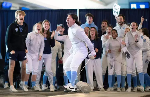 Freshman Dagny Johnson celebrates a sabre win against Duke at the Blue Zone Saturday morning.