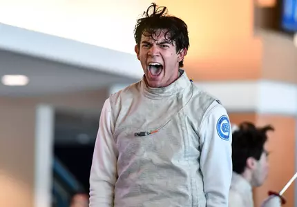 Sophomore Cristian Porras reacts to a win in foil against Duke at the Blue Zone Saturday morning.