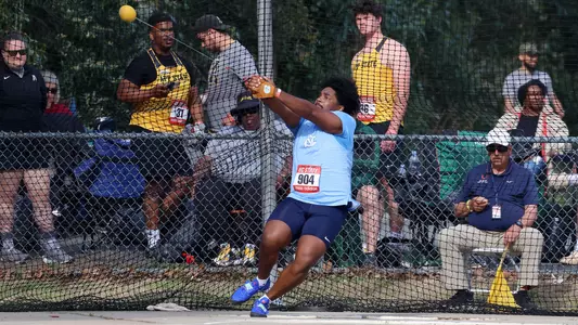 Sophomore Myles Scott rotates during the hammer throw during the Raleigh Relays at Paul Derr Track in Raleigh.