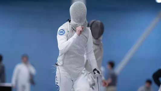 Freshman Peter Bruk reacts to a win in foil against John Hopkins during the Miller Invitational at Eddie Smith Field House Sunday afternoon.