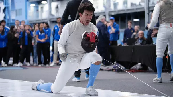 Freshman Cristian Porras reacts to winning a bout in foil against Duke during the ACC Championships at Eddie Smith Field House Saturday.