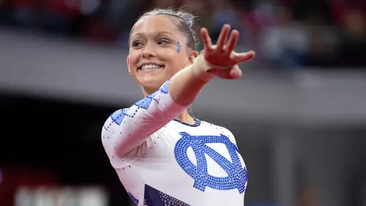 Freshman JoJo Valahovic performs her floor exercise routine against North Carolina State at Reynolds Coliseum Friday night.