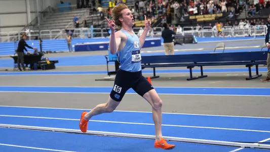 Senior Ethan Strand begins to celebrate winning the 3000-meter National Championship with a time of 7:52.03 at the Virginia Beach Sports Center in Virginia Beach, VA Saturday.