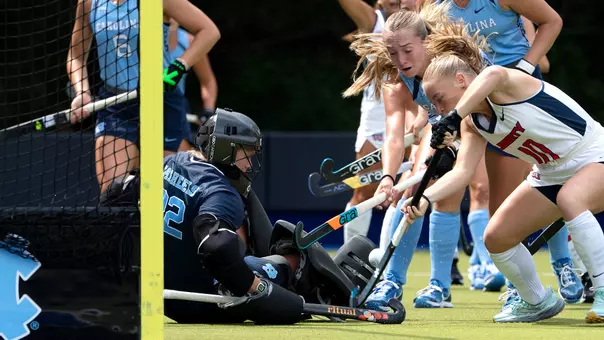 Freshman goal keeper Merritt Skubisz, on ground, and redshirt junior Grace Pottebaum protect the goal against Liberty Sunday afternoon at Karen Shelton Stadium.