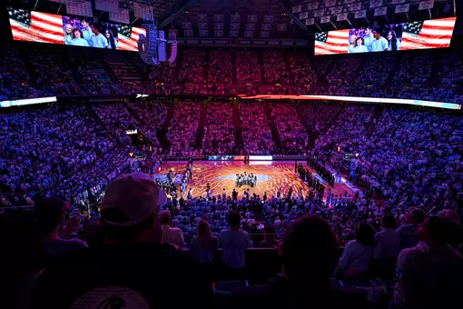 Fans stand at the Dean E Smith Center for the singing of the national anthem prior to UNC playing Wake Forest Saturday.