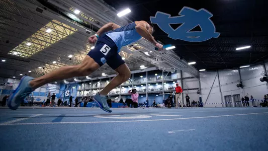 Senior Trevor Paschall leads off the 4x400 relay during the Dick Taylor Carolina Challenge at Eddie Smith Field House Saturday.