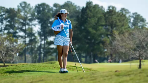 Freshman Mila Tamisier waits for her pairing to finish putting during the Ruth's Chris Tar Heel Invitational at Finley Golf Course Friday.